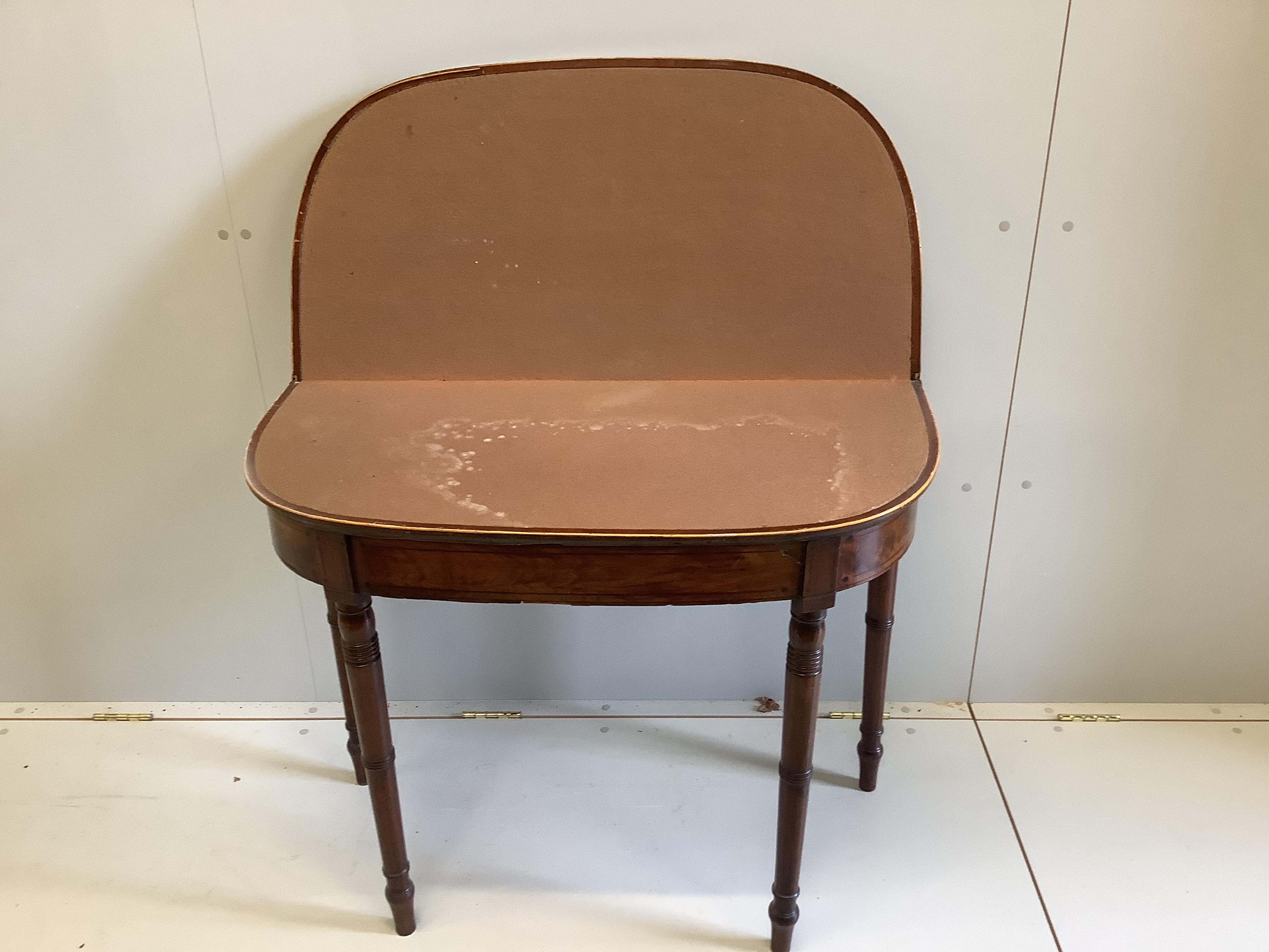 A George III crossbanded mahogany D shaped folding card table, width 91cm, depth 45cm, height 73cm